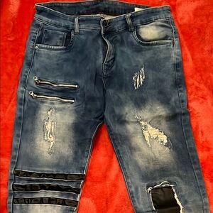 Distressed Blue Jeans with Zipper Details